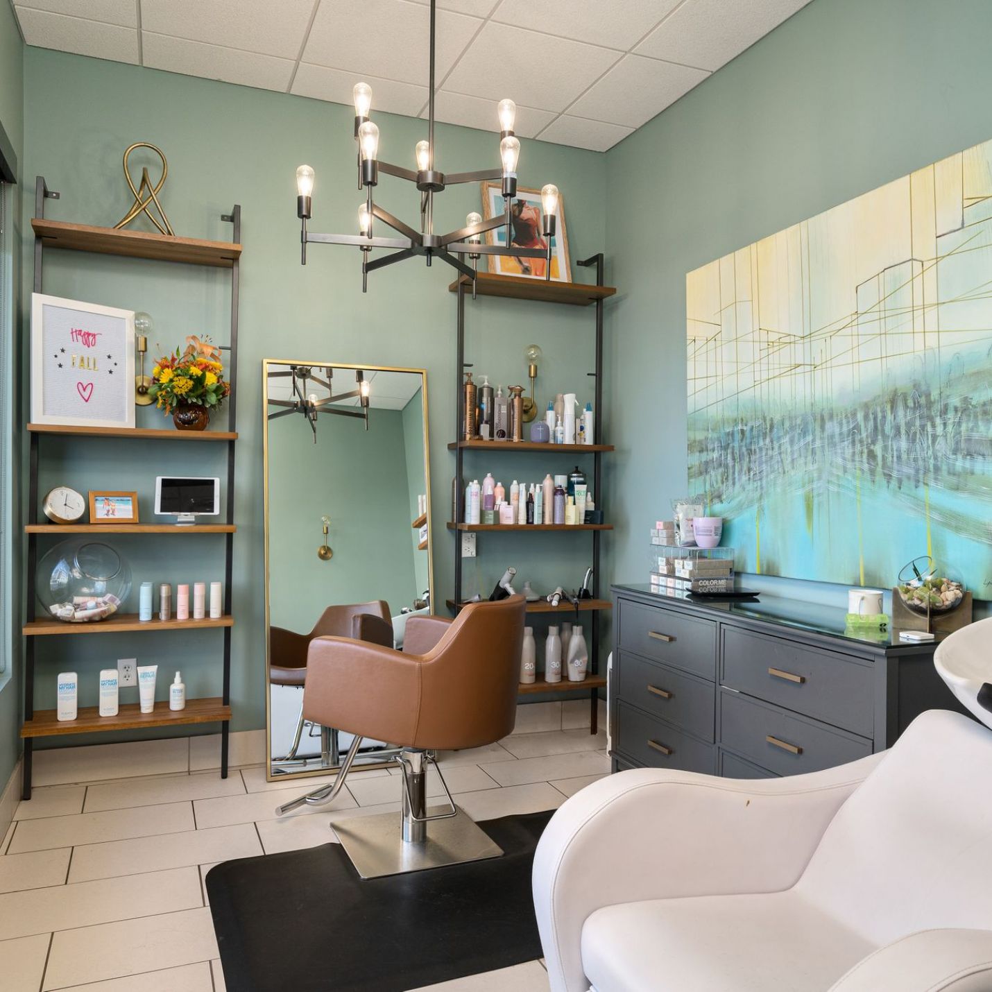 Domain City Center nterior of a salon featuring a chair and sink for hair washing.